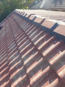 Before roof restoration Liverpool damaged tiled roof